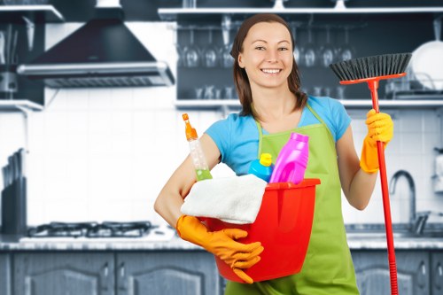 Cleaner Haringey staff using safe manual handling techniques